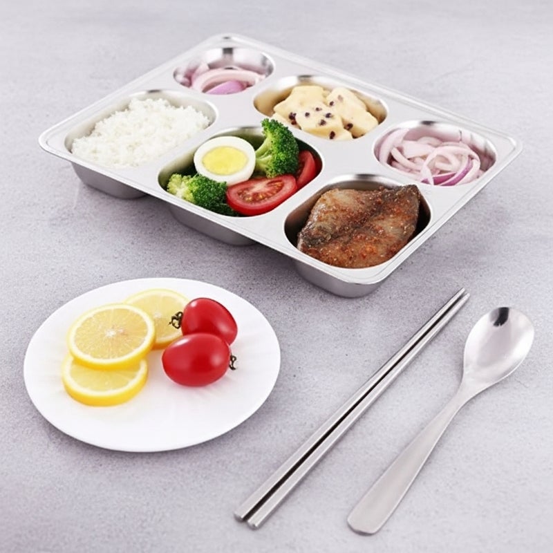 general This stainless steel serving tray, divided into six sections, is specially designed for serving complete meals in an organized and healthy way. It allows you to separate rice, protein, vegetables, sauces, and side dishes within the same dish without them mixing, making it ideal for everyday meals, children's meals, and healthy diets.



Made of high-quality, rust-resistant stainless steel, this tray is durable and sturdy enough to withstand daily use in homes and restaurants. It also features a designated slot for a spoon and fork for added convenience while serving.



Its smooth surface makes it easy to clean and it doesn't absorb odors or flavors, making it a practical and safer alternative to plastic dishes. It's an ideal choice for Egyptian kitchens, schools, hospitals, and lunchboxes. - Image 2